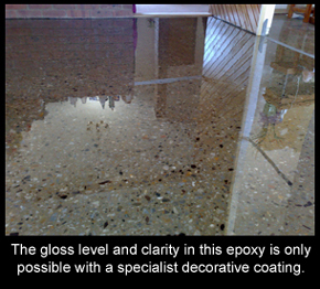Decorative resin floor finish in home with polished concrete look.