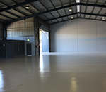 Solid-colour rollcoat in a large warehouse.