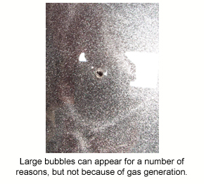 A large crater in an epoxy film caused by an air bubble that burst.