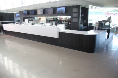 The large bar at the centre of the Adelaide Oval bar room, circled by the decorative epoxy floor.