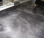 Metallic epoxy floor in a living room.