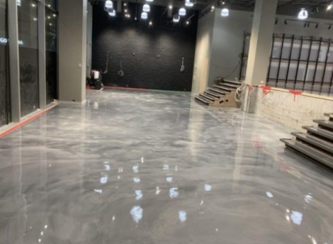 The custom resin flooring design in the middle of being installed in a Melbourne superstore.