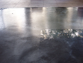 A decorative floor in a cafe with a semi-gloss finish in the high traffic areas and a high-gloss finish everywhere else.