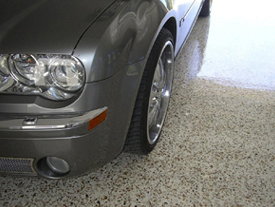 A high-quality flake floor in a garage with no signs of hot tyre pick-up.