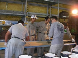 Contractors in Japan having fun learning about metallic epoxies during a training day.