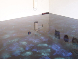 A metallic epoxy floor in a garage with a galaxy effect.