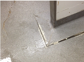 A failed vinyl floor in a commercial kitchen.