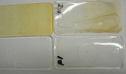 Samples of epoxy resin being tested for yellowing under UV exposure.