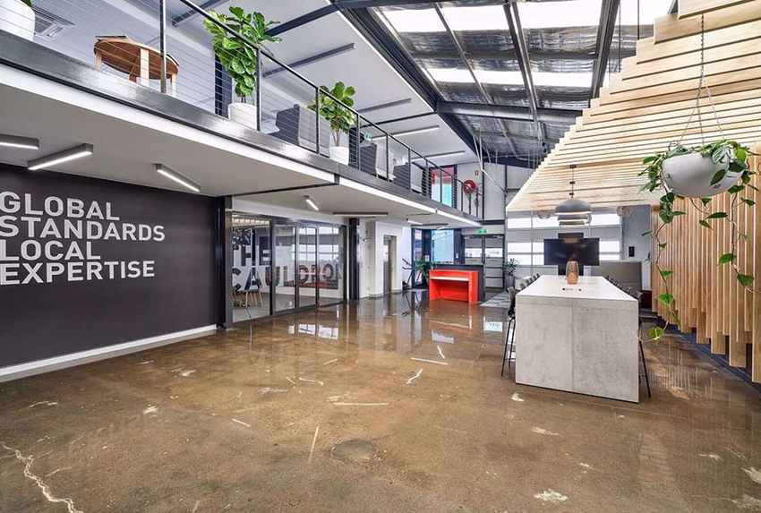 A clear epoxy resin used to create the polished concrete look in a commercial office space.