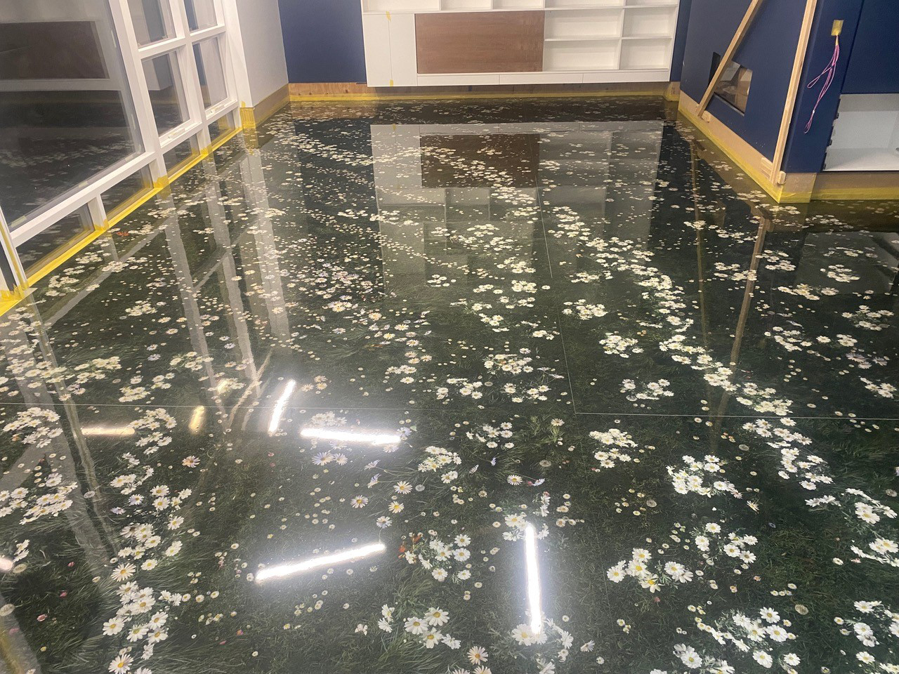 A clear epoxy resin used to encapsulate a floral print on a fabulous 3D floor.