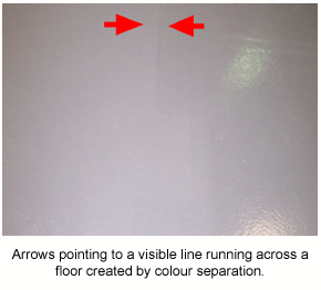 Arrows used on an image of a light grey floor to show a visible colour difference as the result of colour separation.