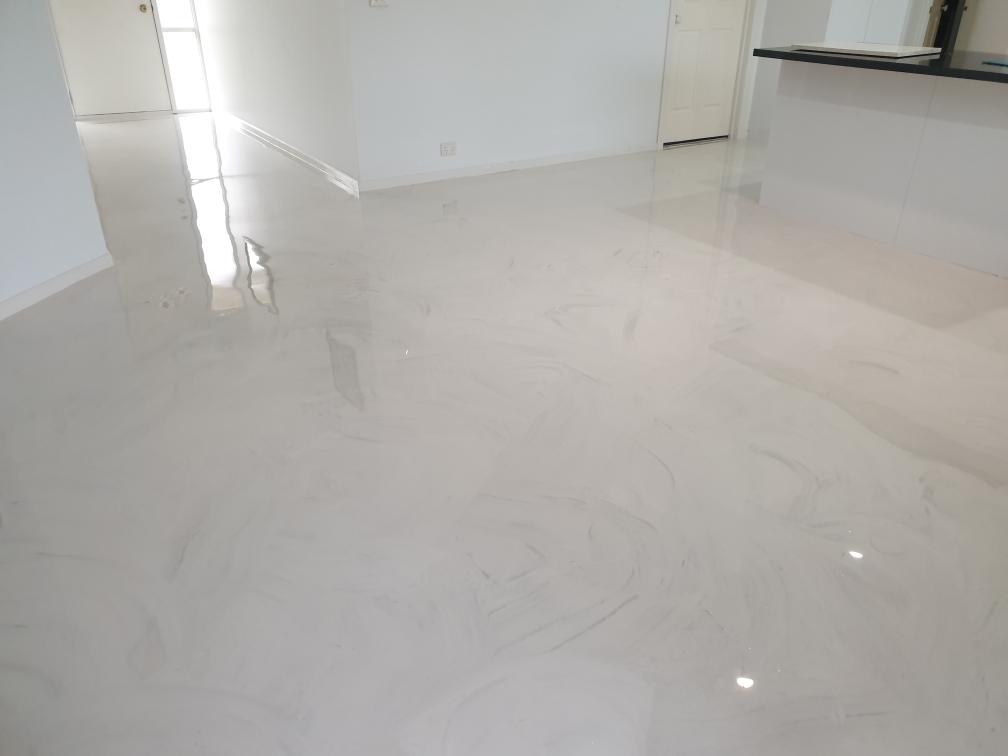A classic soft and subtle marble design on decorative floor in a residential living room.