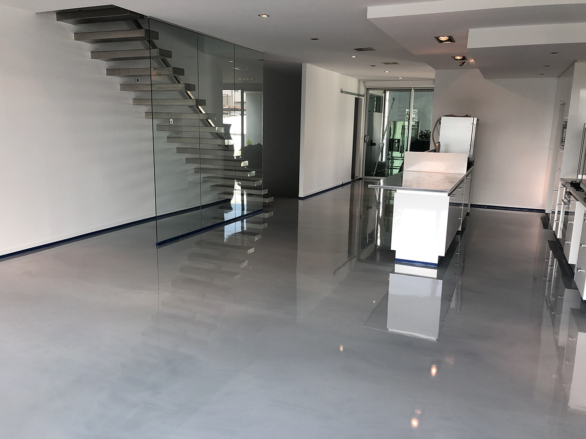 A stunning metallic decorative floor in the kitchen areas of a modern apartment.