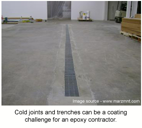 A long drain in a factory that has been installed by cutting a trench into the concrete.