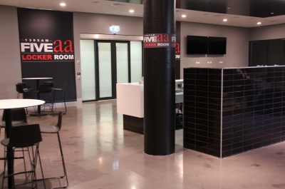 A reverse angle of the Adelaide Oval club room showing the decorative epoxy floor stretching back towards the front entrance.