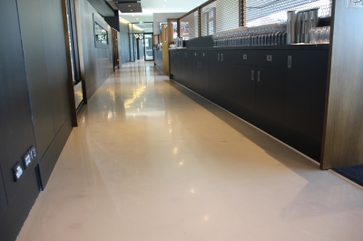 A picture of the Adelaide Oval restaurant showing the glossy decorative epoxy floor curling around a long hallway.