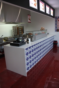 The serving area of the takeaway restaurant with the beautiful decorative epoxy floor making the tiles on the counter really pop.