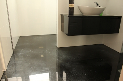 The shower and sink area of the bathroom that was complemented beautifully by the dark metallic epoxy floor.