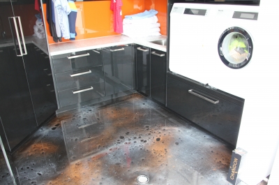 A picture of the finished floor, which was a spectacular, cosmic-looking mix of orange, grey and black that complemented the orange splashback perfectly.