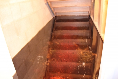 The wine cellar had a small storage room attached where the metallic epoxy floor was also applied.