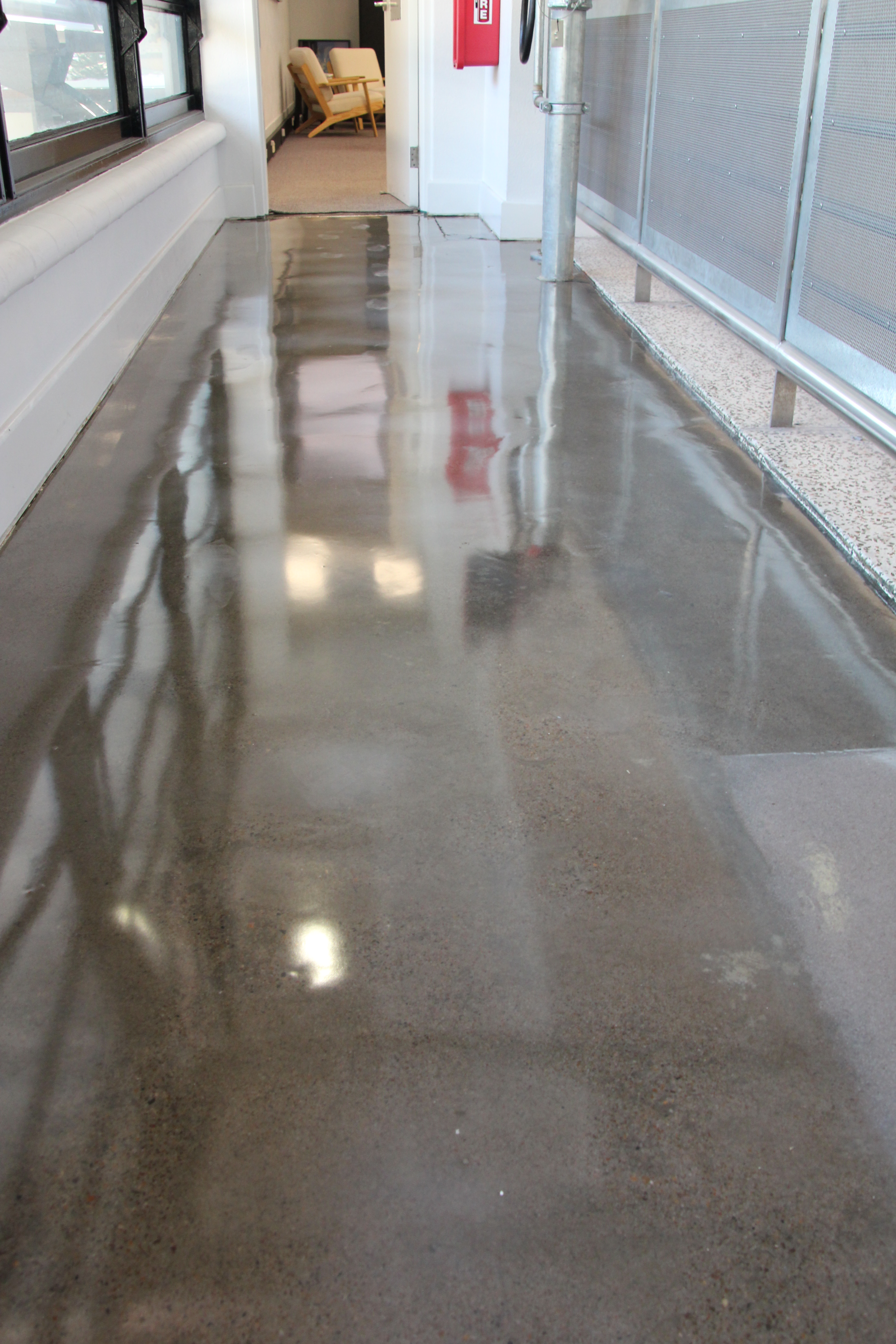 A low-angle shot showing the semi-gloss finish that was achieved on the polished concrete look for this floor.
