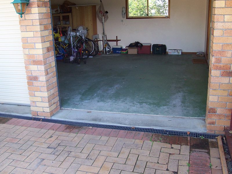 A residential garage before the application of quality epoxy flooring.