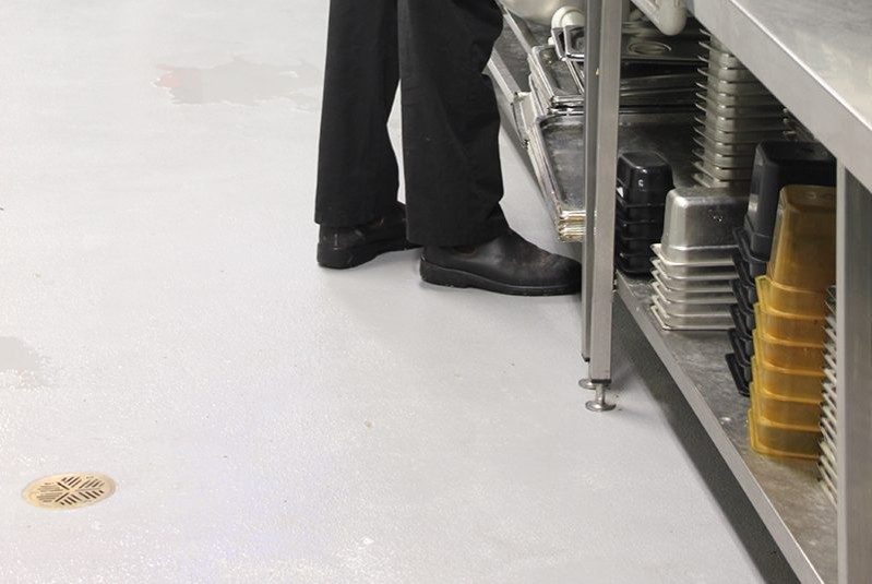 A clean non-slip epoxy flooring in a commercial kitchen.