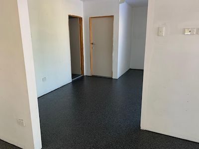A Resin Granite flake floor in the garage and entrance of a home.