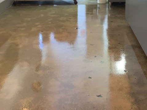 Ezypoxy Clear used to seal and prime a concrete subfloor in a retail outlet.