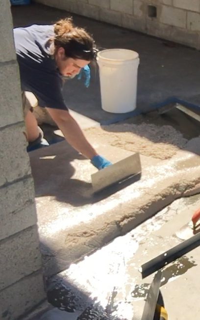 Ezypoxy Clear being used in a mortar to install a ramp in an industrial shed.