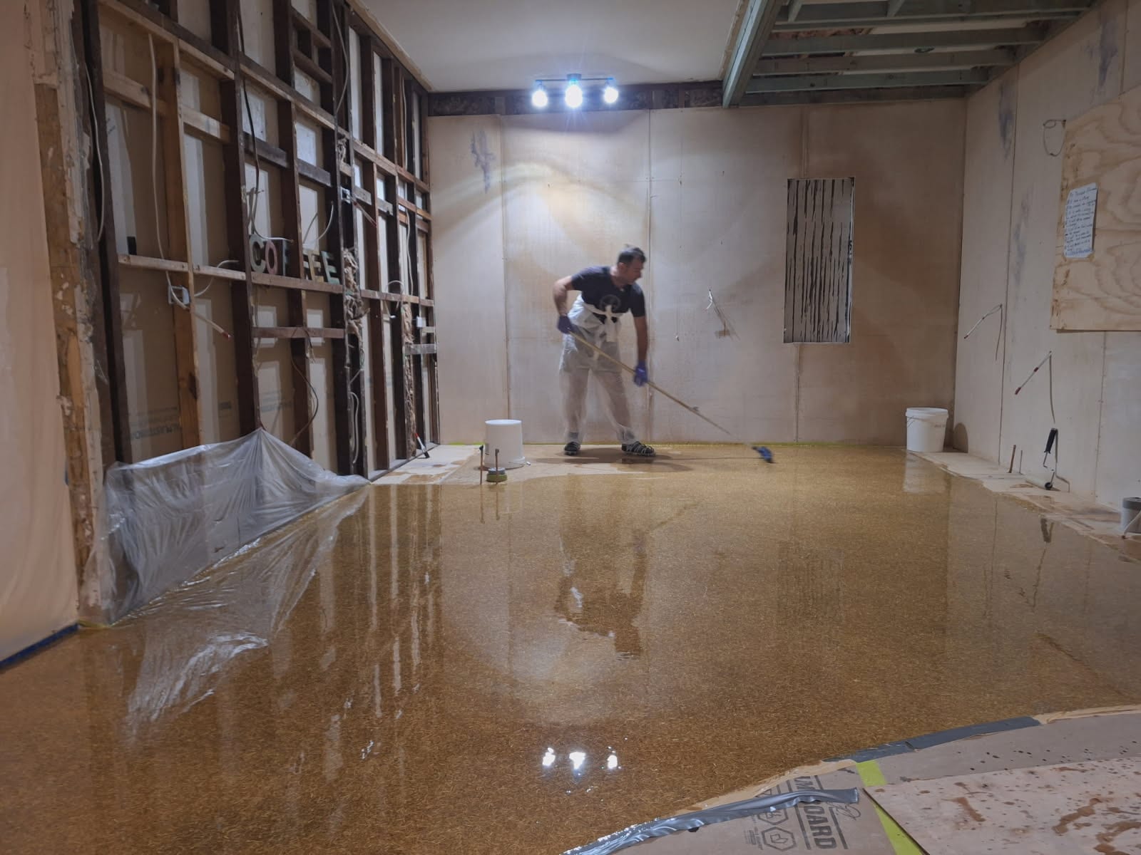 A photo taken at the completion of the project showing the vibrant signal red non-slip epoxy floor being used by workers in the abattoir.