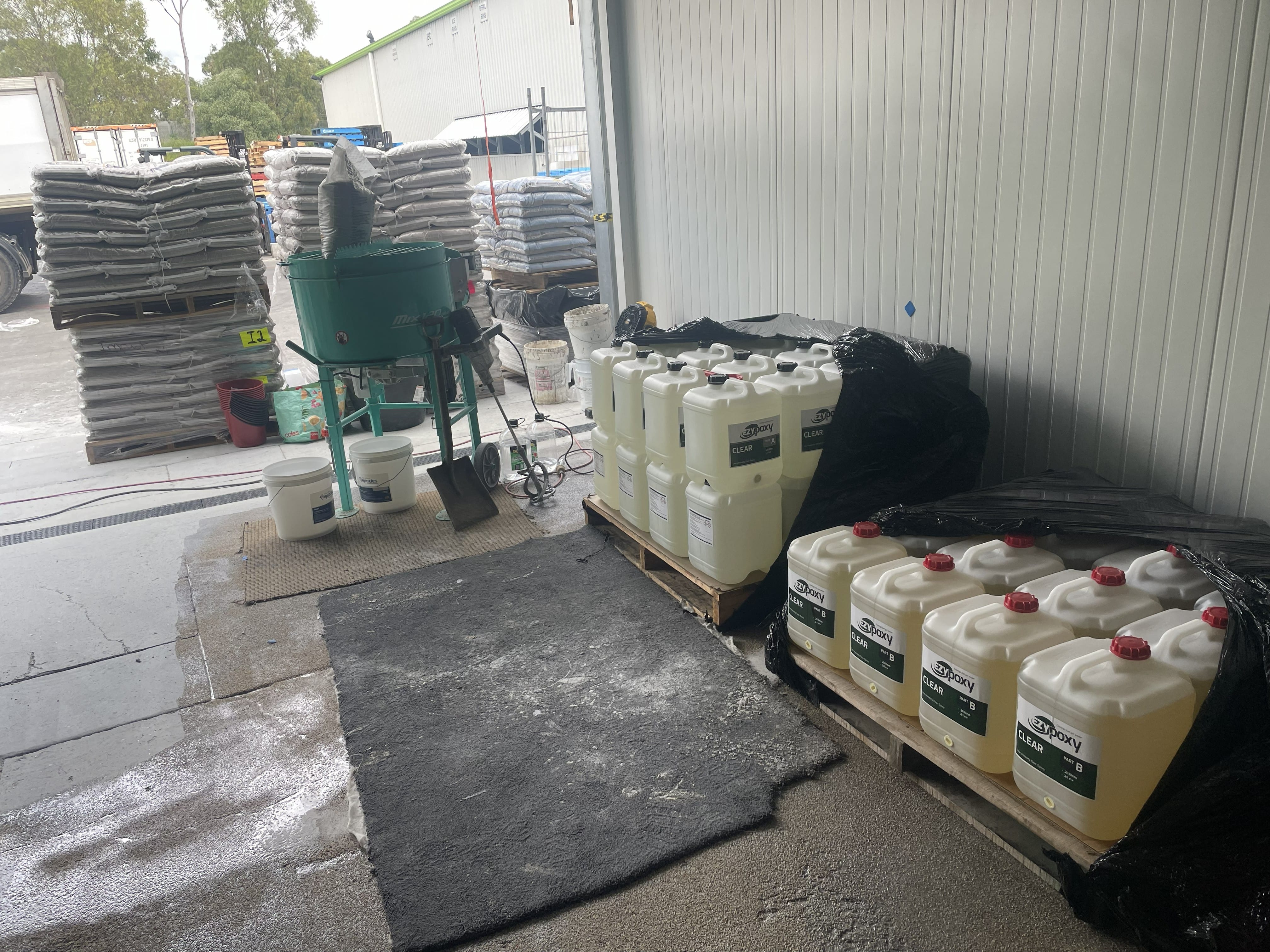 A photo taken at the completion of the project showing the vibrant signal red non-slip epoxy floor being used by workers in the abattoir.