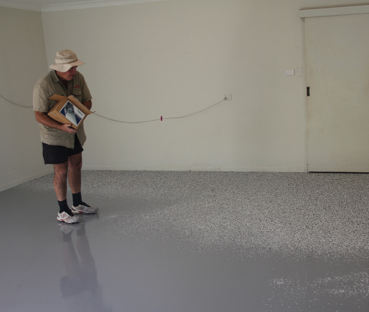 A train waiting to enter a workshop where the Jaxxon industrial coatings were used to create a durable, non-slip floor.