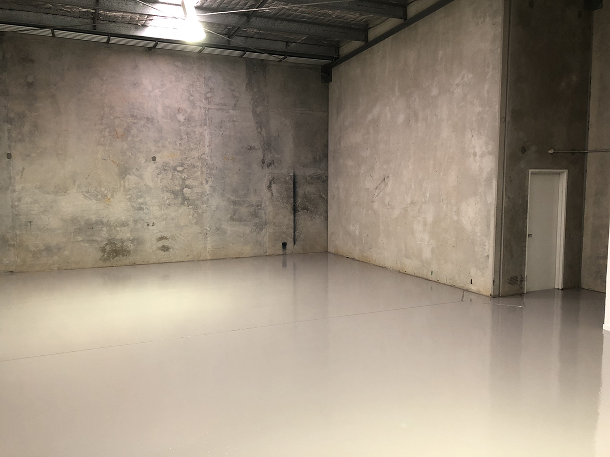 A food processing facility with trolleys on top of Jaxxon industrial coatings.