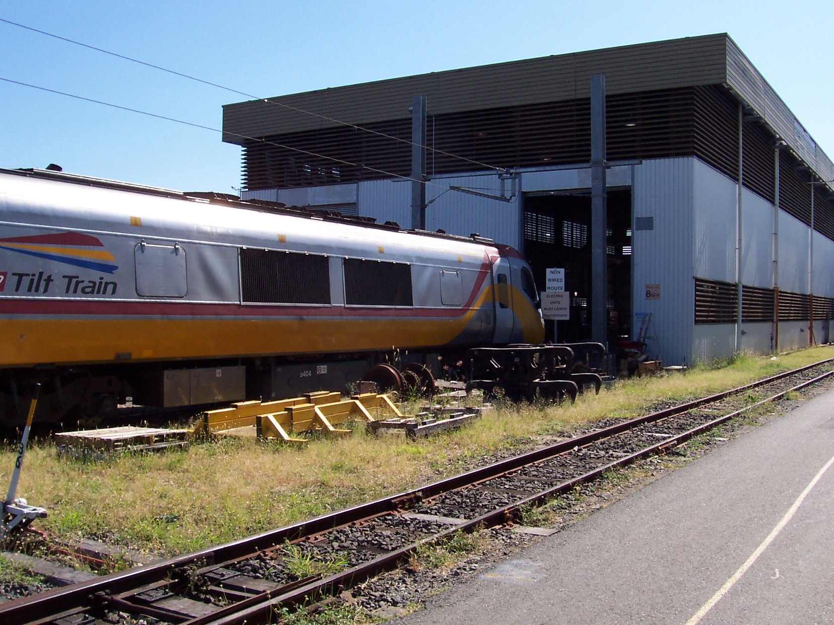 A train waiting to enter a workshop where the Jaxxon industrial coatings were used to create a durable, non-slip floor.