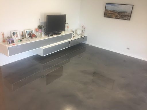 A soft and subtle dark grey finish was created with Artepoxy Liquid Crystal in this residential living room.