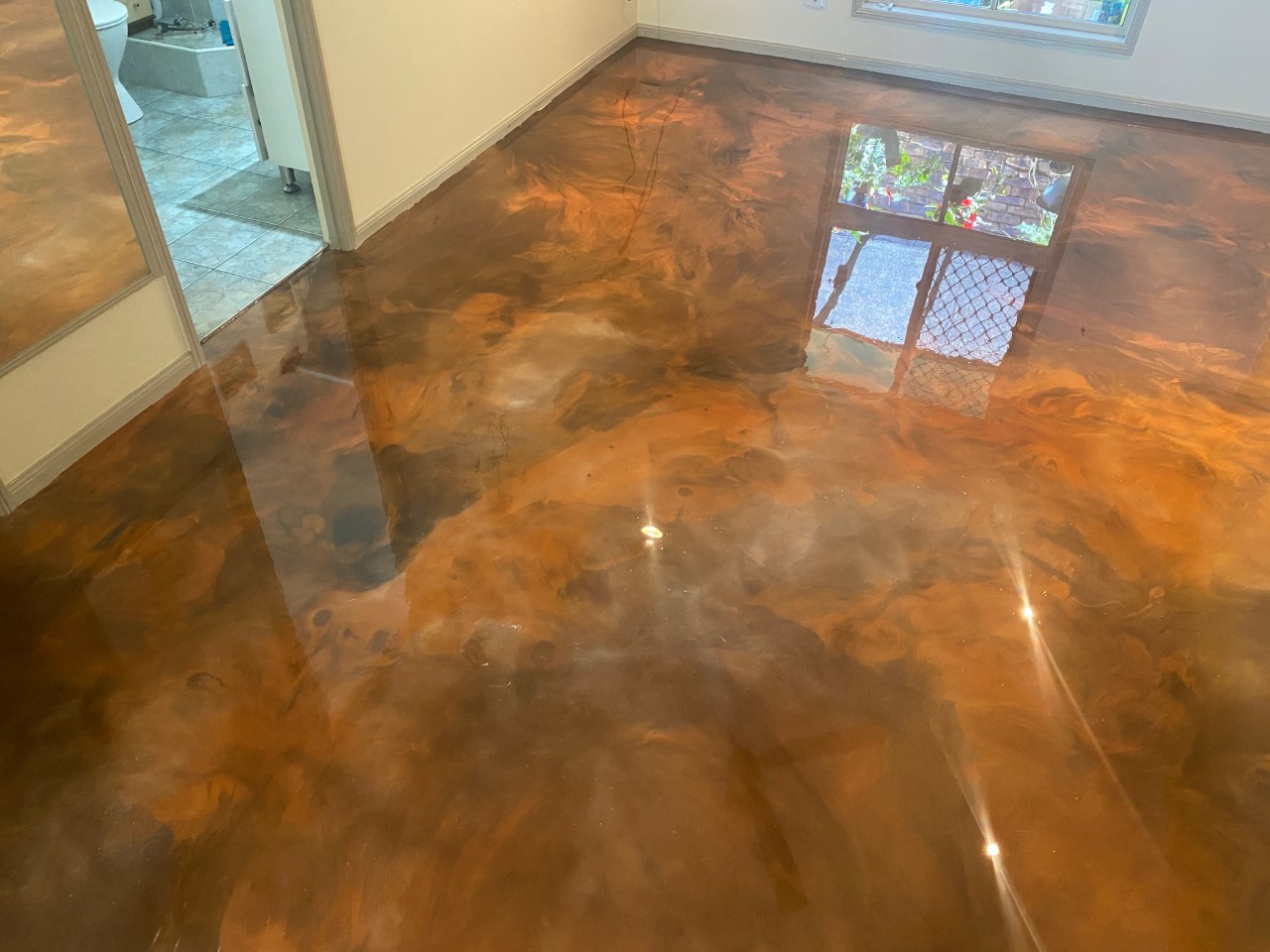 A close up of a realistic copper metallic finish that was created using Artepoxy Liquid Crystal.