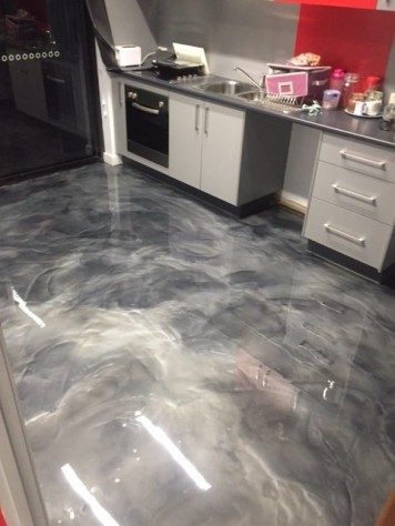 A kitchen in an office used Artepoxy Liquid Marble to create a custom grey metallic finish to their floor.