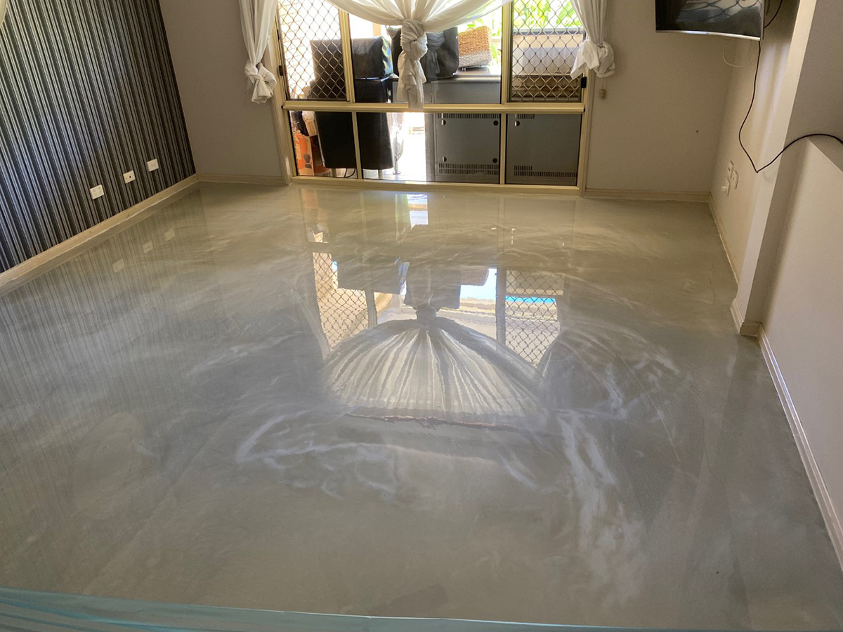 The glare through a residential lounge room window shows the beautiful glossy marble finish of Artepoxy Liquid Marble.