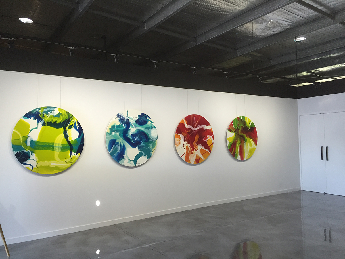 An empty printing business with beautiful artwork on the walls and a glossy Artepoxy Liquid Marble floor.