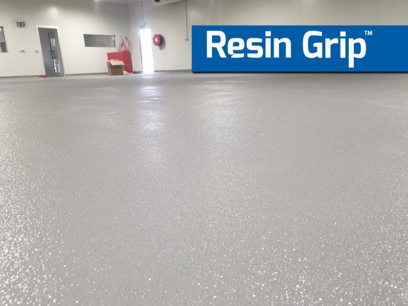 A low-angle photo of a Resin Grip floor in a commercial facility showing the textured finish of the protective non-slip epoxy system.
