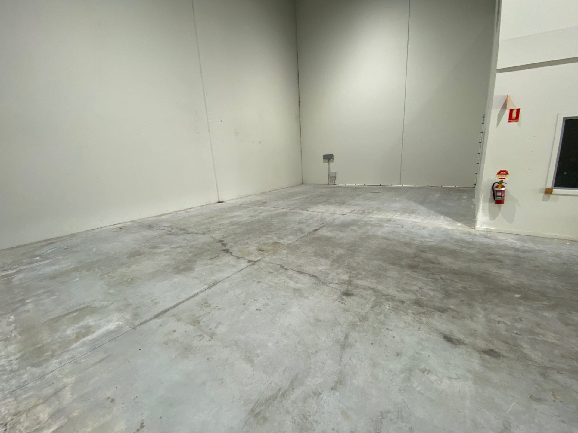 A photo taken at the completion of the project showing the vibrant signal red non-slip epoxy floor being used by workers in the abattoir.
