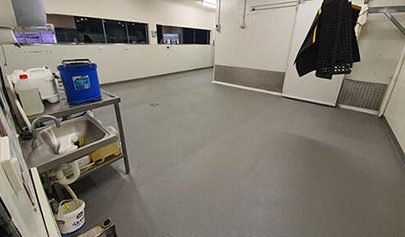 A commercial kitchen and cold room with a dark grey Resin Grip system installed.