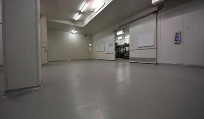 A Resin Rock system with non-slip finish installed in a commercial kitchen cold room.