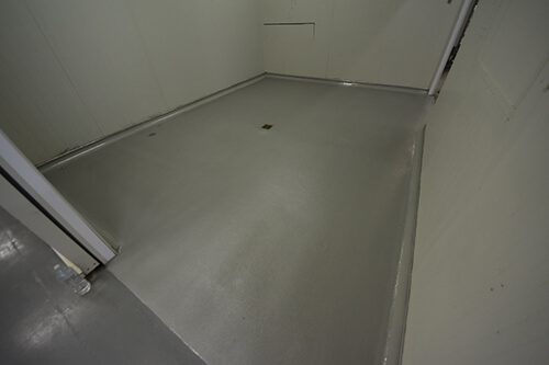 A Resin Rock system with non-slip finish installed in a commercial kitchen cold room.