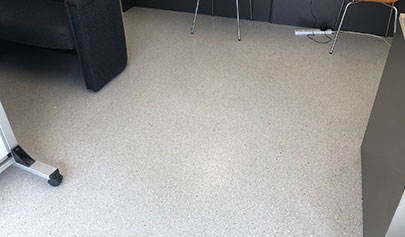The Resin Granite system installed in a commercial office area with lounges, chairs and other office furniture.