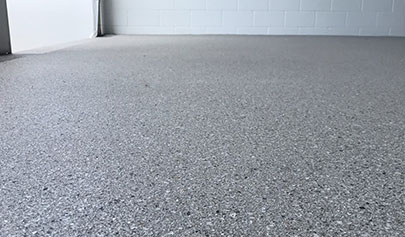A low-angle shot of the Resin Granite system in a residential garage.