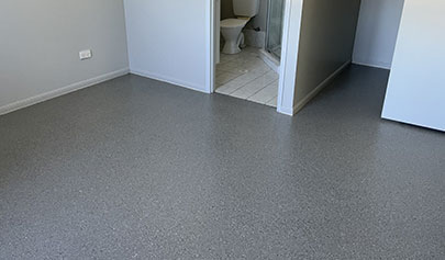 The Resin Granite system installed in a residential bedroom that joins onto a tiled bathroom.