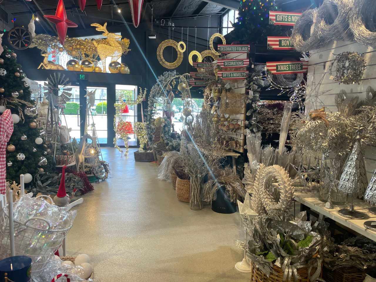 A view of the new flake floor from the back of the store, looking towards the front entrance with lots of decorations on display.
