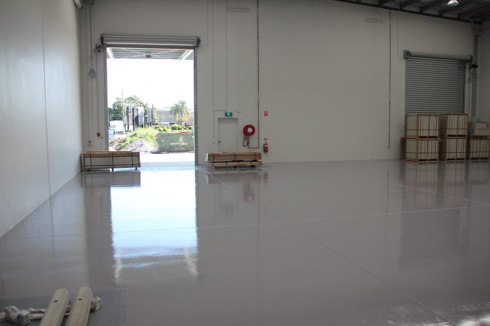 The Resin Guard system installed in a new, yet empty warehouse with the large front roller door open.